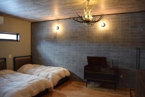 Postel nebo postele na pokoji v ubytování 無鹿リゾート