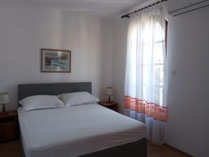 Ένα ή περισσότερα κρεβάτια σε δωμάτιο στο villa Adriana apartments +87 φωτογραφίες