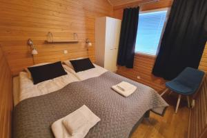 Кровать или кровати в номере Kuukkeli Apartments Suite