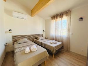 Ένα ή περισσότερα κρεβάτια σε δωμάτιο στο Villa Balaruc-Les-Bains