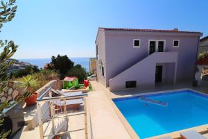 a villa with a pool and a view at Villa Lavanda Korčula in Zavalatica