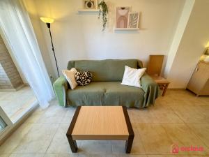 a living room with a couch and a coffee table at Rincón Ideal in Oropesa del Mar