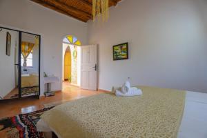 Postel nebo postele na pokoji v ubytování Aura Retreat