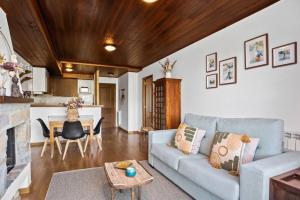 a living room with a couch and a table at Garbo by Cardi Suites in Formigal
