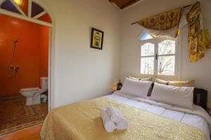 Postel nebo postele na pokoji v ubytování Aura Retreat