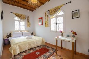Postel nebo postele na pokoji v ubytování Aura Retreat