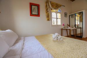 Postel nebo postele na pokoji v ubytování Aura Retreat