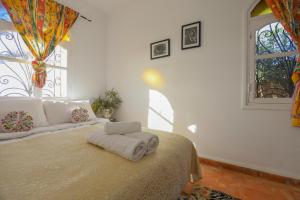 Postel nebo postele na pokoji v ubytování Aura Retreat