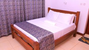 Ένα ή περισσότερα κρεβάτια σε δωμάτιο στο Lovely Tarnishia 2 Bedroom