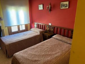 Postel nebo postele na pokoji v ubytování DORMERO Hotel y Albergue Sahagun