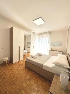 Ένα ή περισσότερα κρεβάτια σε δωμάτιο στο Casa Vittoria - tra Lago Maggiore e centro città +31 φωτογραφίες