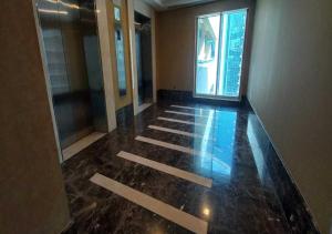 an empty hallway of a building with a window at Bay Square studio Bay view in Dubai