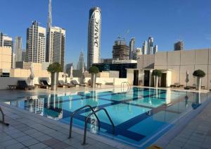 a large swimming pool on top of a building at Bay Square studio Bay view in Dubai