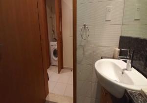 a bathroom with a sink and a toilet at Bay Square studio Bay view in Dubai
