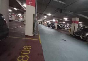 a parking garage with cars parked in it at Bay Square studio Bay view in Dubai