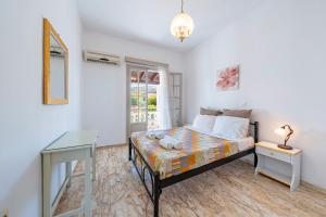 Postel nebo postele na pokoji v ubytování Kassiopi Apartment 2 + 20 fotografií