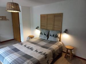 Postel nebo postele na pokoji v ubytování Les Sapins
