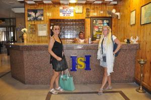 a man and a woman standing in front of a bar at Shady Hotel Luxor in Luxor +36 photos
