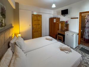 Postel nebo postele na pokoji v ubytování Skiathos Platis House