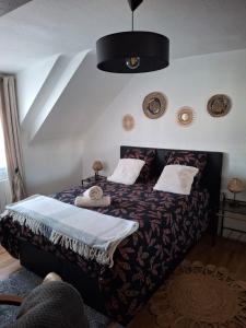 Postel nebo postele na pokoji v ubytování L'Armor