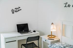 En eller flere senge i et værelse på Casa Mare View Wi-Fi AC