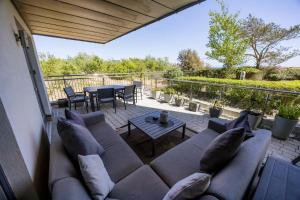a living room with a couch and a table at Sea Breeze - Close to Bournemouth Beach and Seafront in Bournemouth