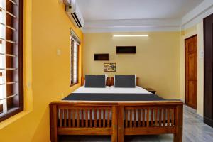 Postel nebo postele na pokoji v ubytování Hotel O LM RESIDENCY