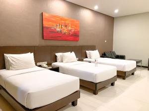 Voodi või voodid majutusasutuse Savana Hotel & Convention Malang toas