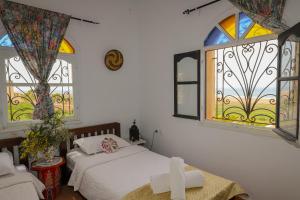 Postel nebo postele na pokoji v ubytování Aura Retreat