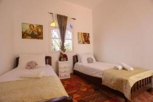 Postel nebo postele na pokoji v ubytování Aura Retreat