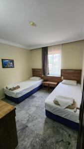 En eller flere senge i et værelse på Irem Apart Hotel + 51 billeder