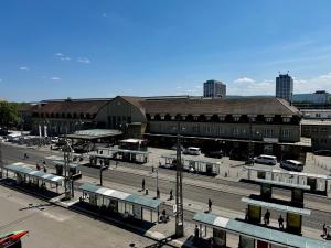 a city with buses parked in front of buildings at #centralstation #130qm Hauptbahnhof #netflix in Karlsruhe