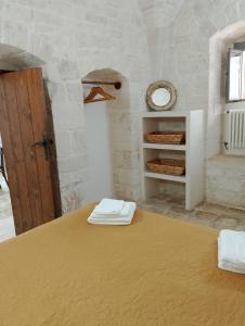 A bed or beds in a room at Trullo Gio