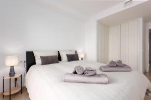A bed or beds in a room at marina real 221 Még 35 kép