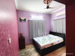 Кровать или кровати в номере Kinaara Homestay Where The Coast Feels Like Home