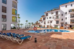 The swimming pool at or close to marina real 221