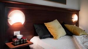 Letto o letti in una camera di Albergo Reale