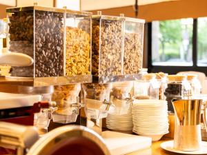 a counter with a bunch of different types of food at Hotel Cristallo in Giulianova