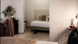 Letto o letti in una camera di Albergo Reale