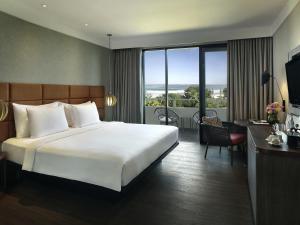 Postel nebo postele na pokoji v ubytování Pullman Bali Legian Beach