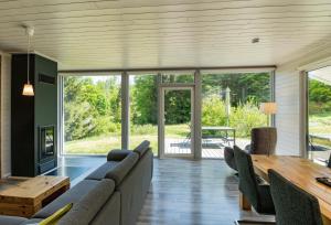 a living room with a couch and a table at 2 Personen mit Sauna F3H5 in Ruhla +11 photos