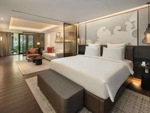 Postel nebo postele na pokoji v ubytování Pullman Bali Legian Beach