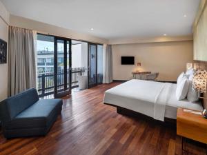 Postel nebo postele na pokoji v ubytování Pullman Bali Legian Beach