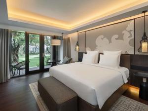 Postel nebo postele na pokoji v ubytování Pullman Bali Legian Beach