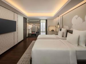 Postel nebo postele na pokoji v ubytování Pullman Bali Legian Beach