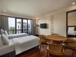 Postel nebo postele na pokoji v ubytování Pullman Bali Legian Beach