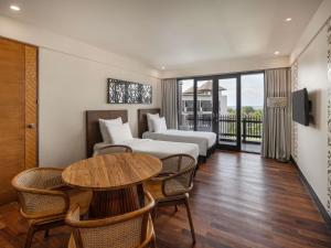Postel nebo postele na pokoji v ubytování Pullman Bali Legian Beach