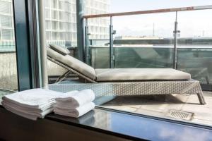 a glass counter with towels and a chair on a window at Scandic Simonkenttä in Helsinki