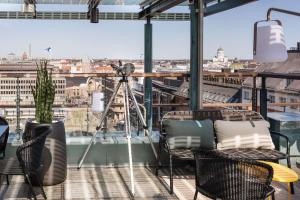 a camera on a balcony with a view of a city at Scandic Simonkenttä in Helsinki
