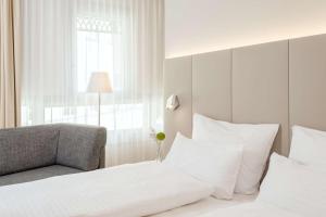 Voodi või voodid majutusasutuse NH Graz City toas